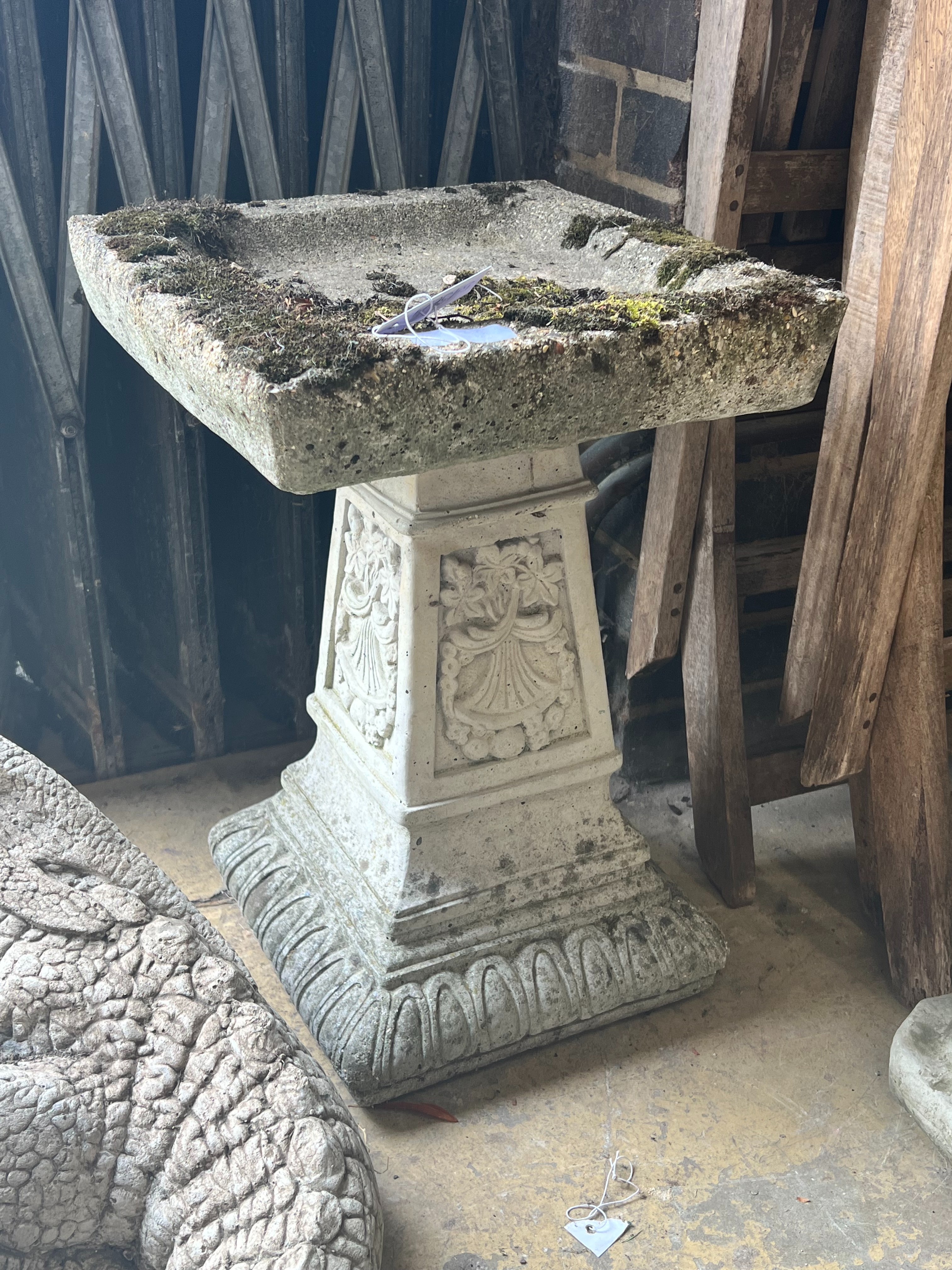 A reconstituted stone square garden bird bath, width 36cm height 54cm